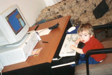 A young Llewellyn at the family computer